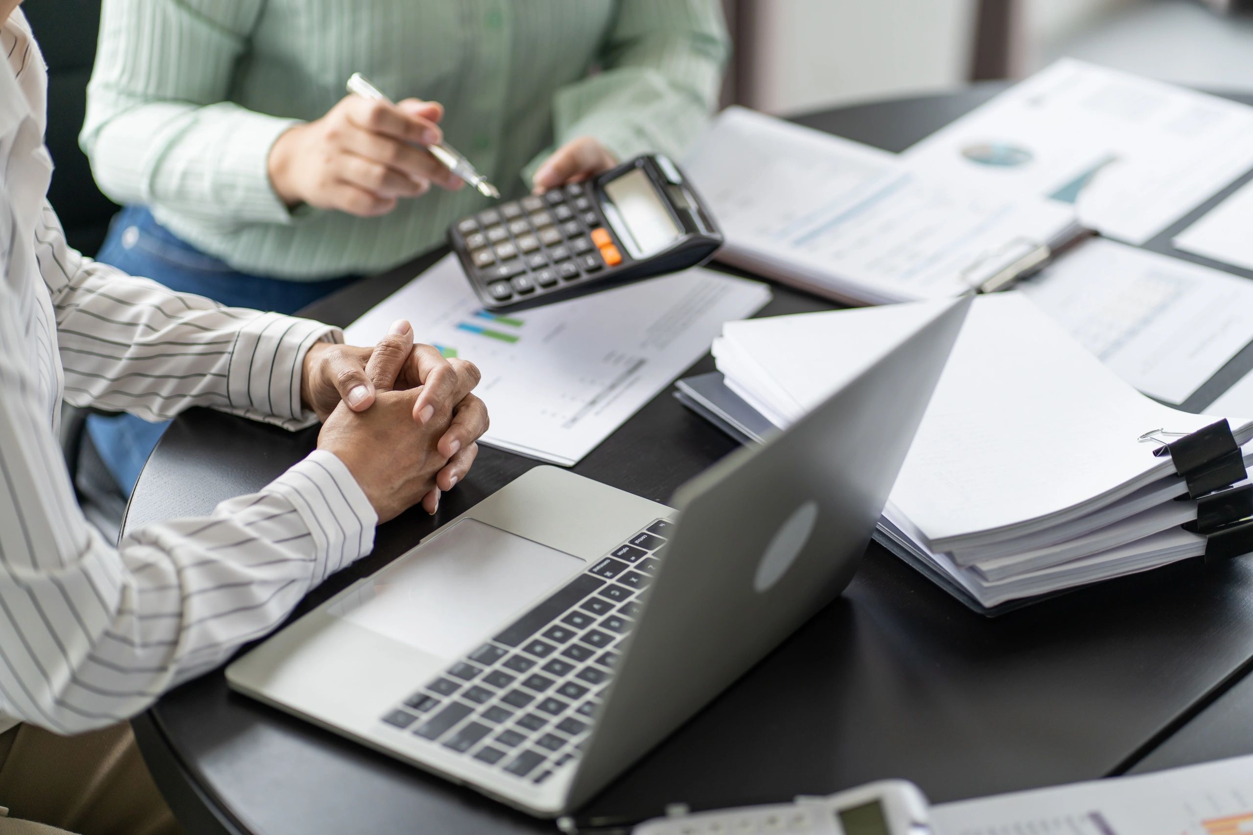Aniles & Co team collaborating on financial analysis
